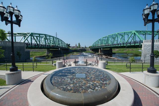 Westfield, Ma Center fountain with two green bridges in background.