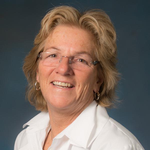 Jennifer Hixon, Chair of the Health Sciences Department at Westfield State University, smiles while posing for a professional photo.