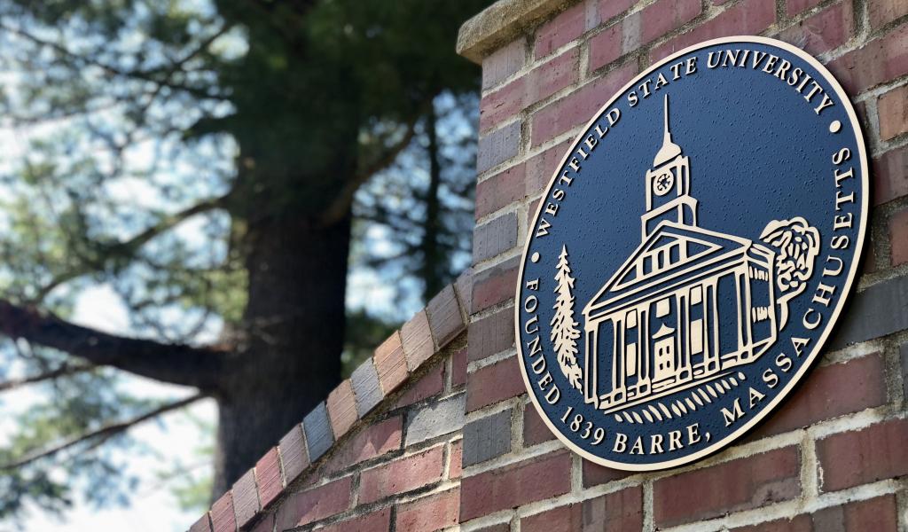 The Westfield State University Seal on the main campus gate