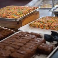 Pan of brownies and rainbow rice crispy treats.